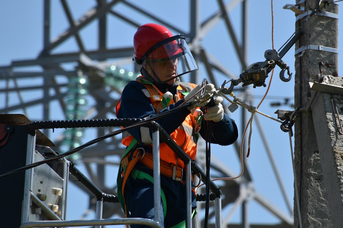 Technician fixing a cable